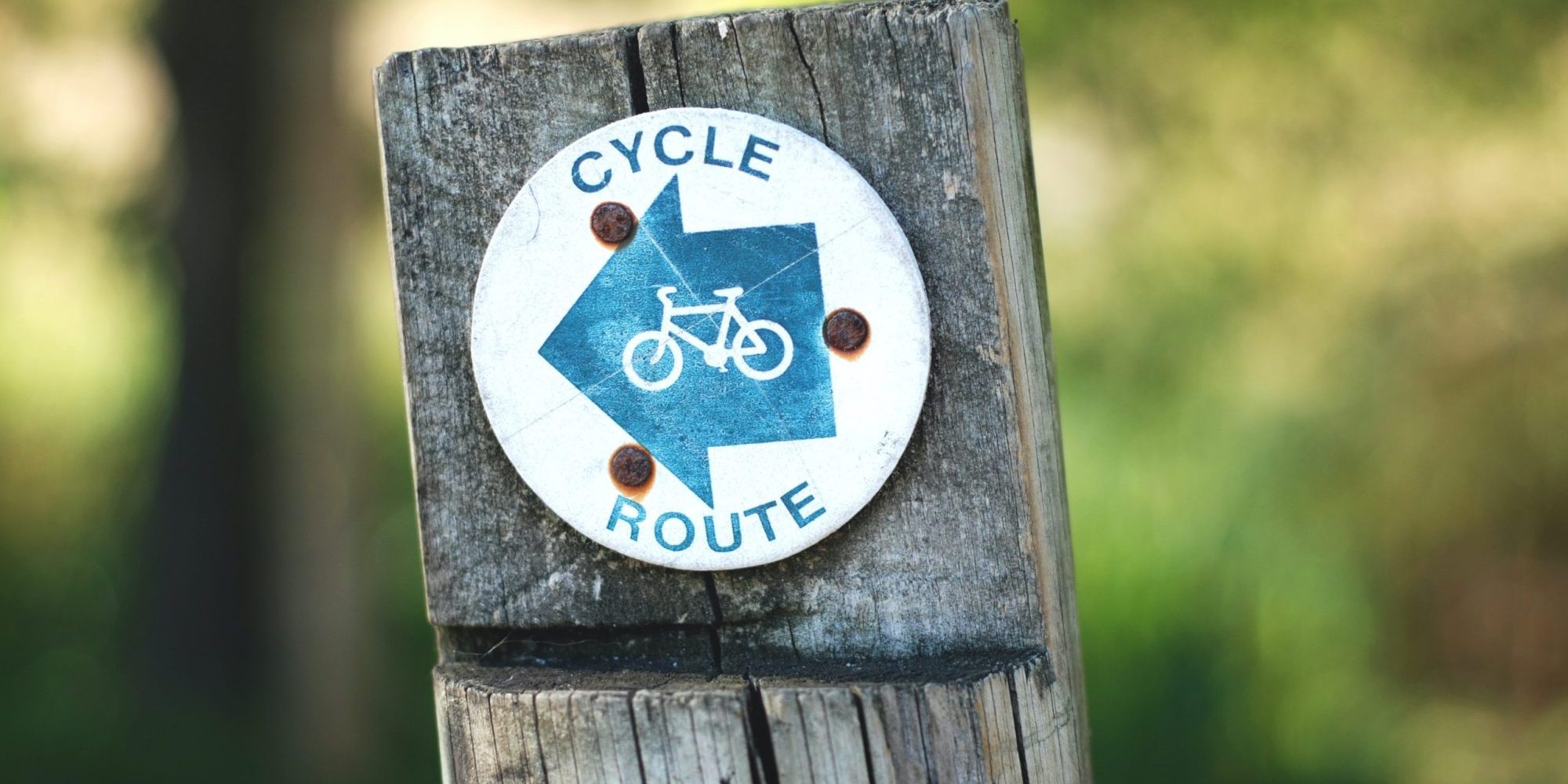 gemma-evans-LTEo69JUv7o-unsplash-1-scaled-e1676982784896 Cycle route sign