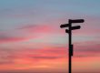 Signpost and sunset