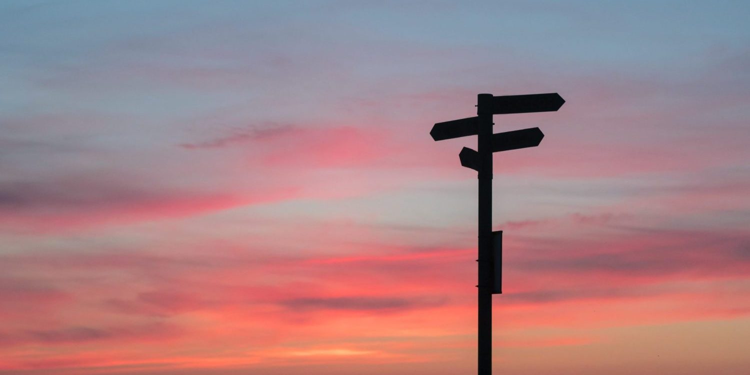 Signpost and sunset