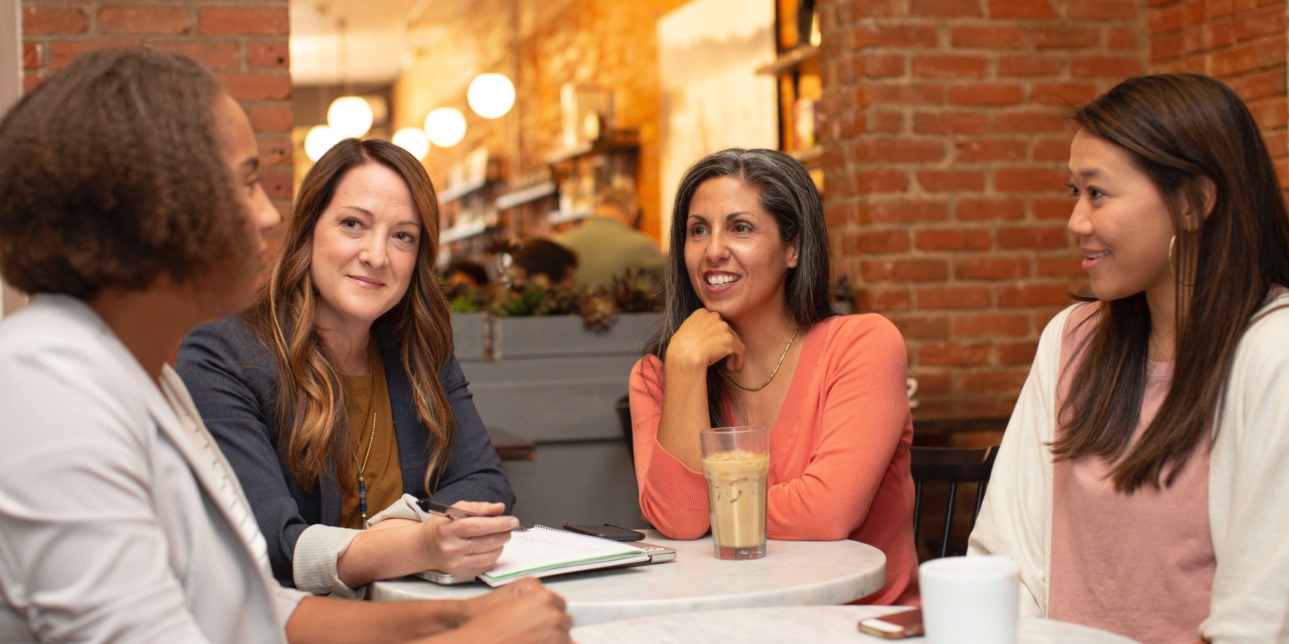 Women talking around a table