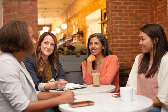 linkedin-sales-solutions-IjkIOe-2fF4-unsplash Women talking around a table