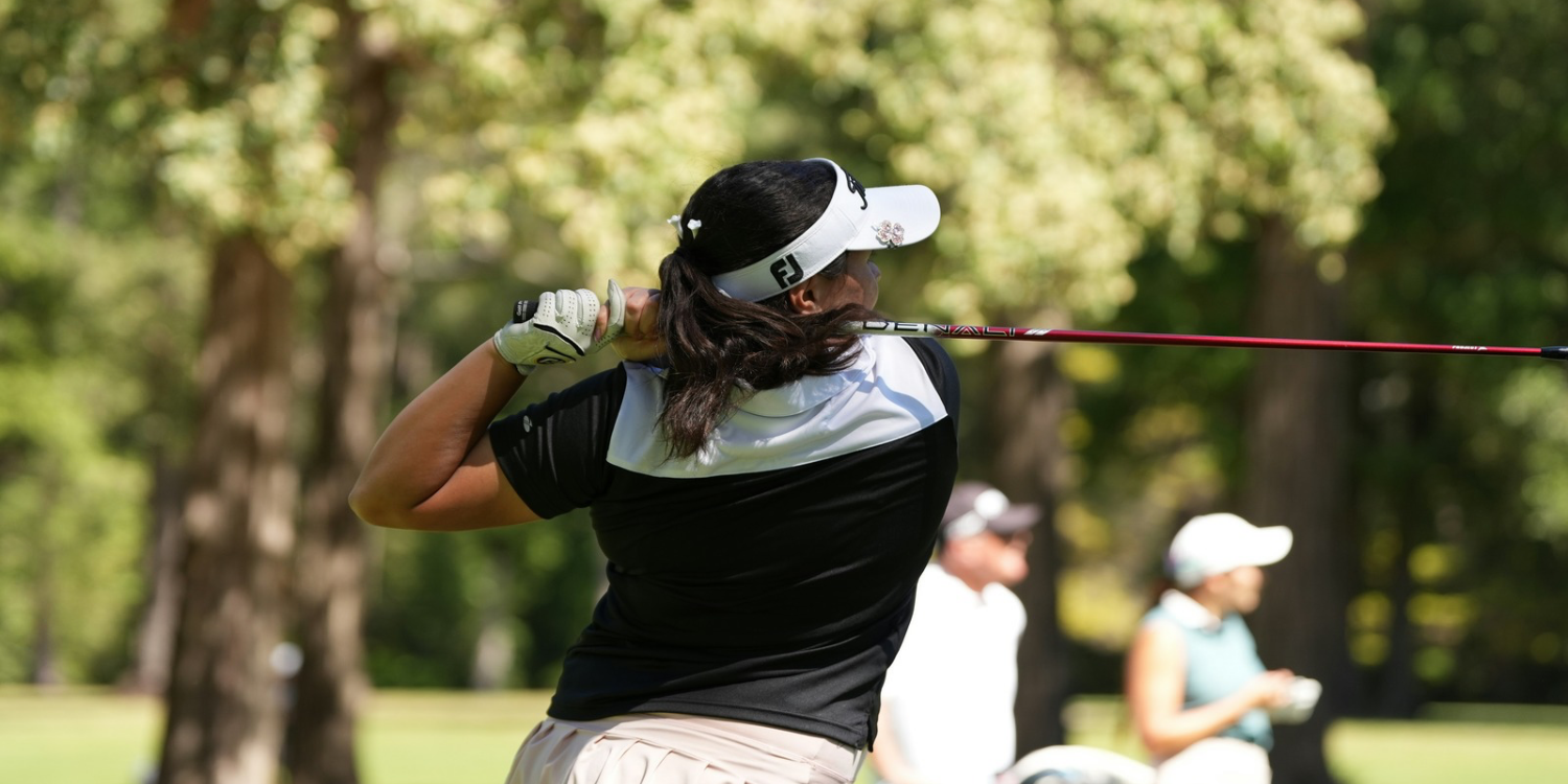 Women’s golf apparel 2026 Woman wearing a visor hitting a tee shot