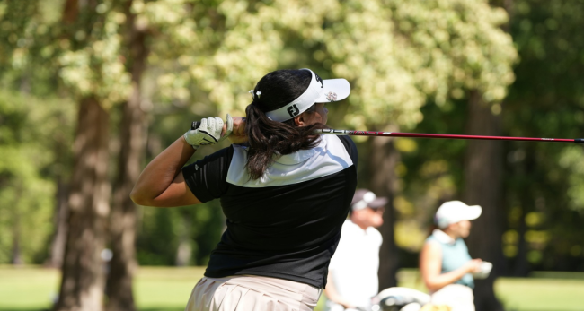 Women’s golf apparel 2026 Woman wearing a visor hitting a tee shot